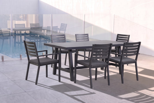 AZALEA VII 6-Seater Outdoor Dining Setting - Black beside a pool on an alfresco terrace