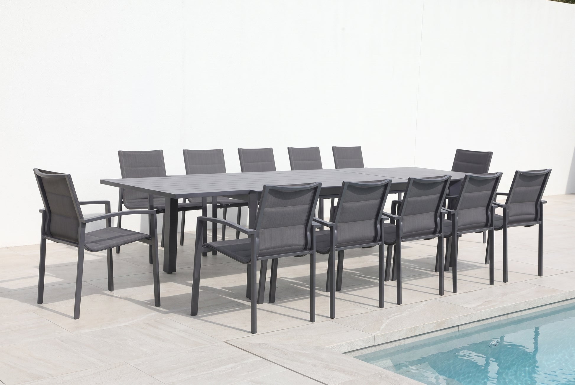 CARDO XIII 12-Seater Extending Outdoor Dining Setting on a light porcelain paved terrace