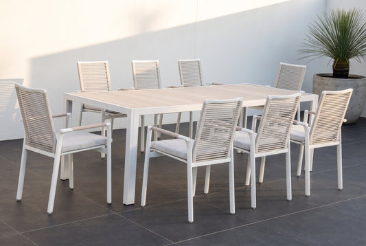 CARRUBO IX 8-Seater Outdoor Dining Setting on a large format dark charcoal porcelain paved terrace