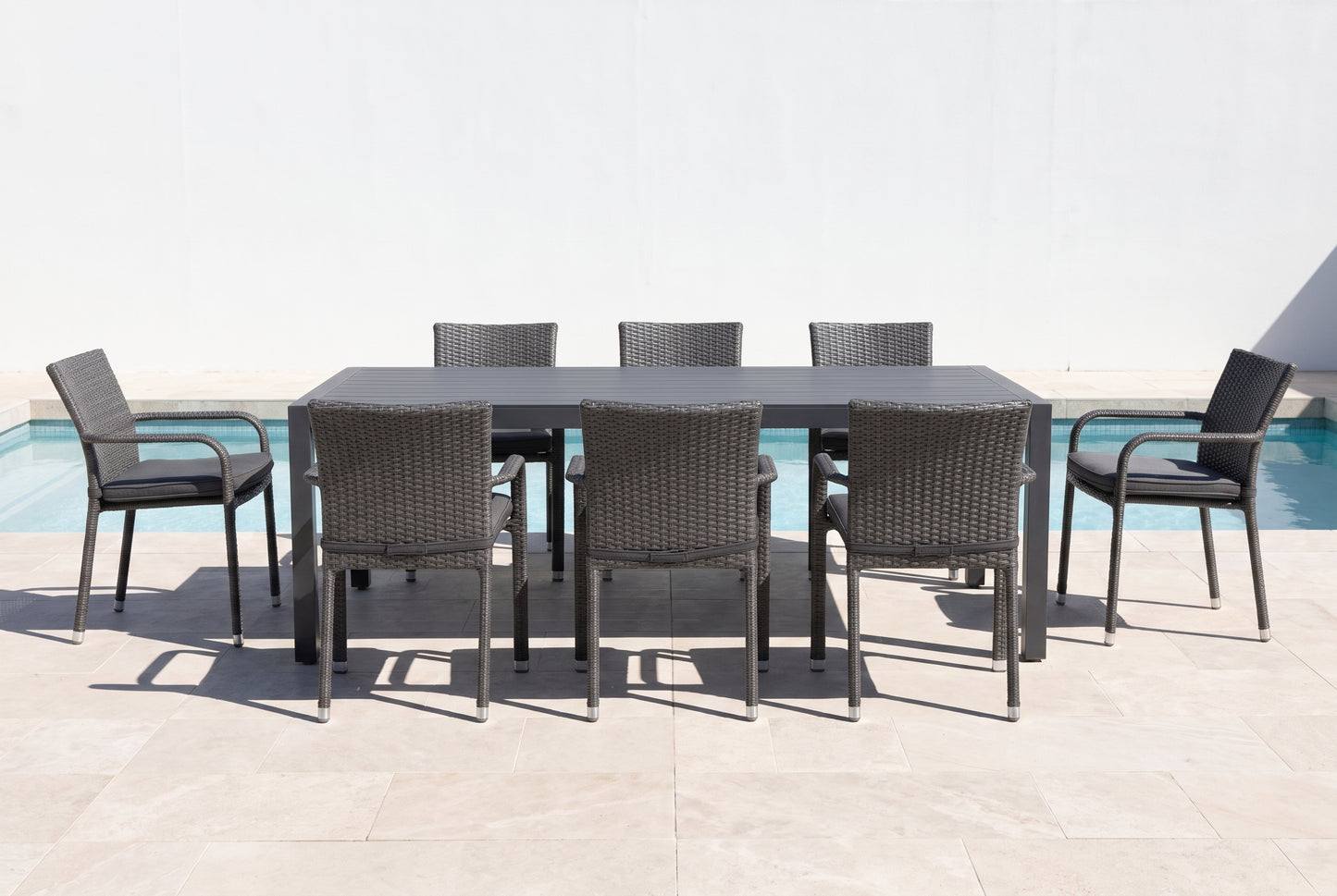 FICO IX 8-Seater Outdoor Dining Setting beside a pool on an alfresco terrace