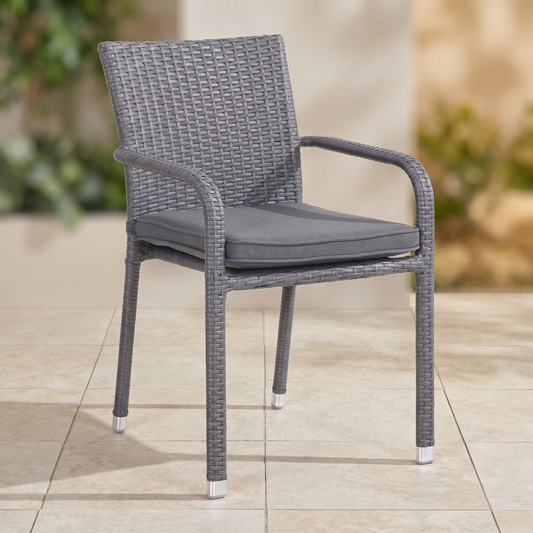 FICO Stackable Outdoor Dining Chair on a light porcelain paved surface