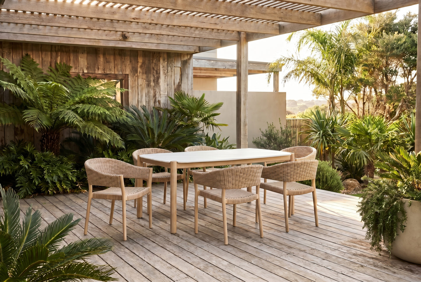 KERRIA VII 6-Seater Outdoor Dining Setting on a weathered timber deck of a coasted Australian home