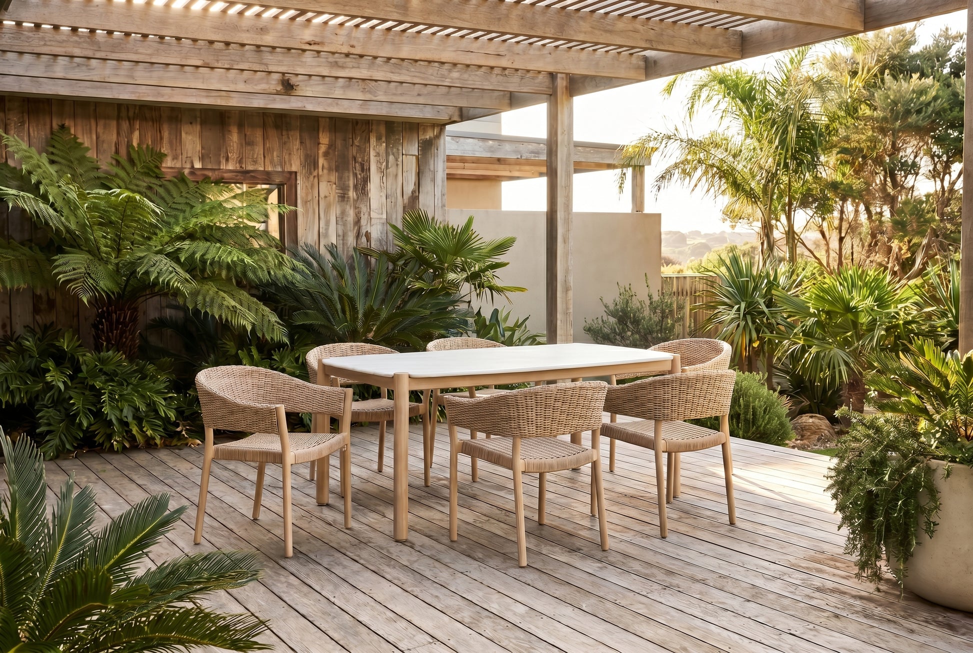 KERRIA VII 6-Seater Outdoor Dining Setting on a weathered timber deck of a coasted Australian home
