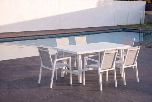 LUPINO VII 6-Seater Outdoor Dining Setting beside a pool on an alfresco terrace