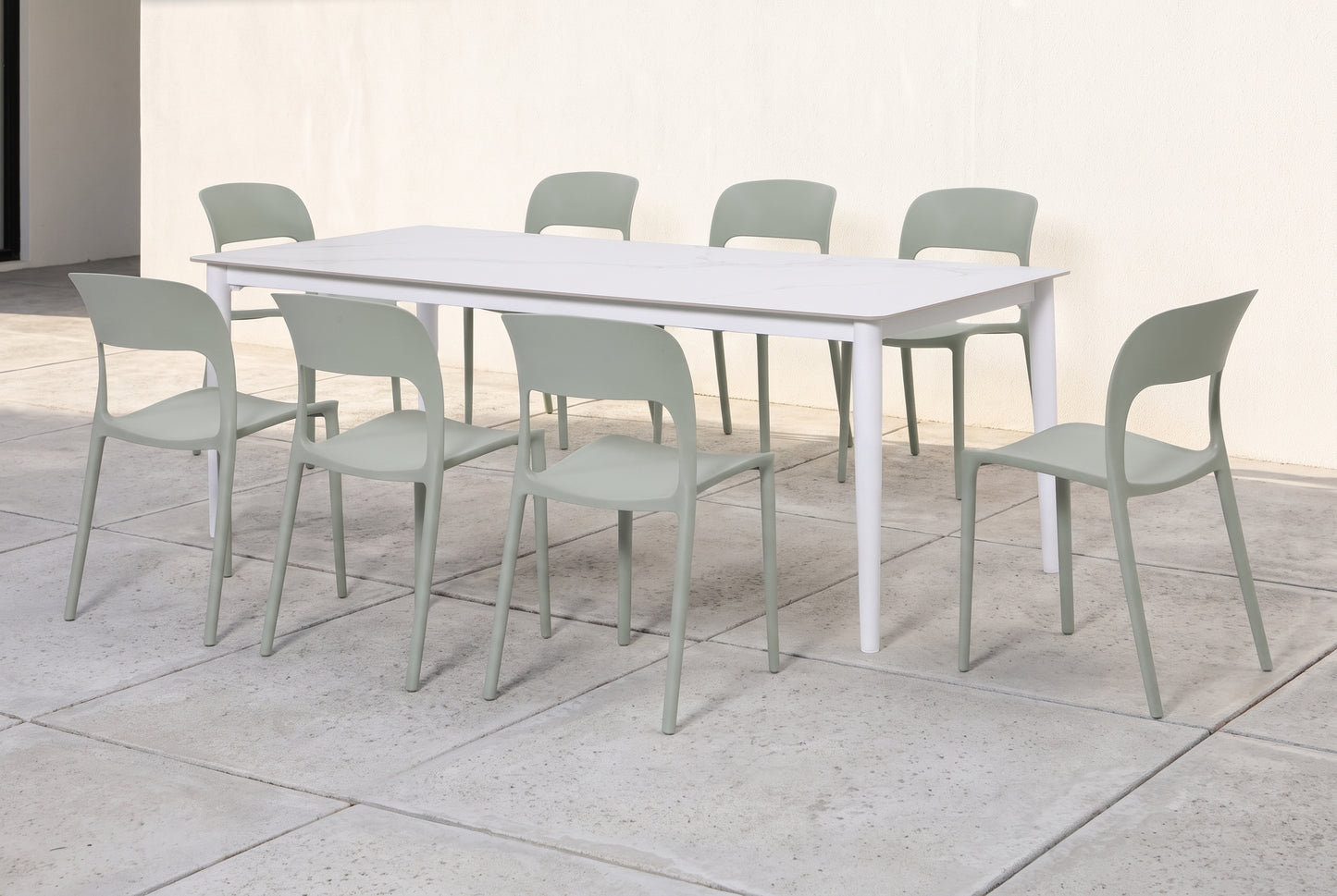 OLIVO IX 8-Seater Outdoor Dining Setting on a light grey concrete paved terrace