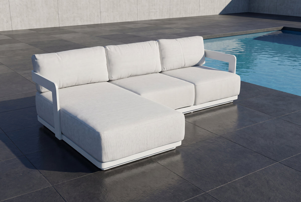 OLMO 3-Seater Outdoor Chaise Lounge beside a pool on a dark charcoal porcelain paved terrace