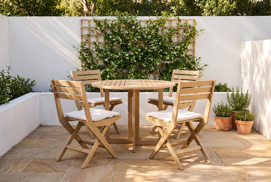 PAPIRO V 4-Seater Foldable Outdoor Dining Setting in a sandstone paved courtyard of a coastal Australian home