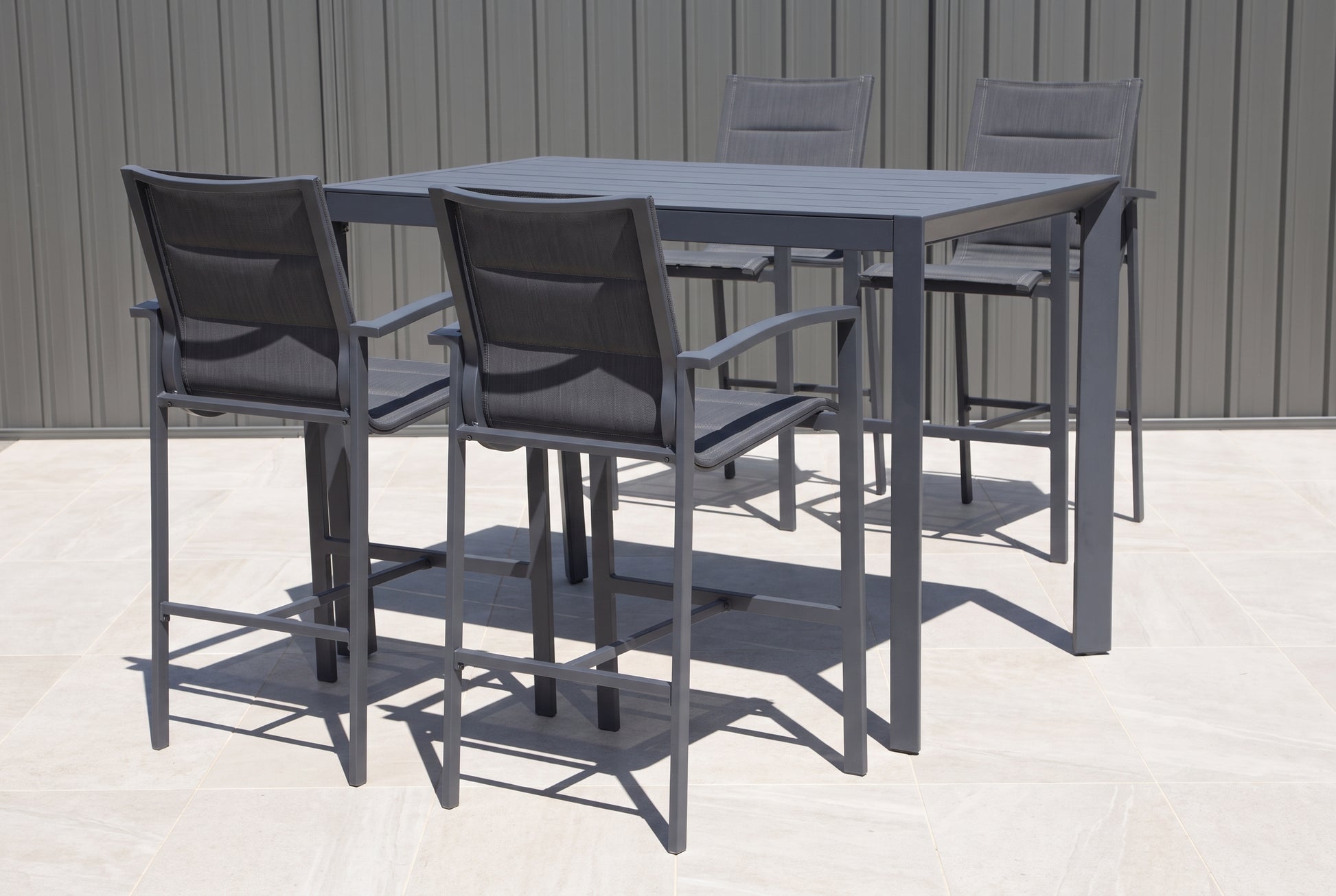 PERO V 4-Seater Outdoor Bar Setting on a light porcelain paved terrace