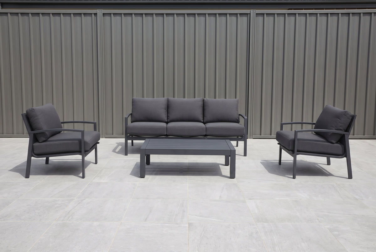 PESCO IV 5-Seater Outdoor Lounge Setting in Gunmetal on a light porcelain paved terrace