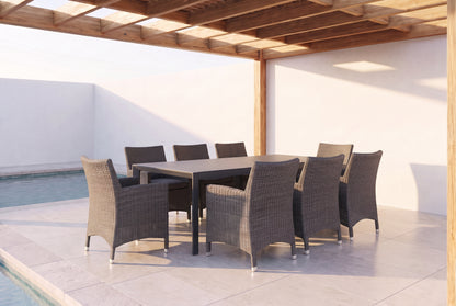 ROVERE IX 8-Seater Outdoor Dining Setting beside a pool on an alfresco terrace