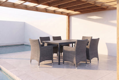 ROVERE VII 6-Seater Outdoor Dining Setting beside a pool on an alfresco terrace