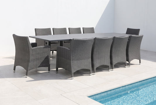 ROVERE XI 10-Seater Extending Outdoor Dining Setting on a light porcelain paved terrace