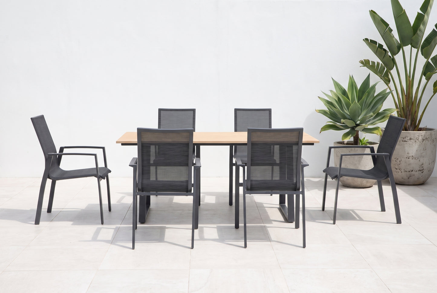 SUSINO VII 6-Seater Outdoor Dining Setting on a light porcelain paved terrace