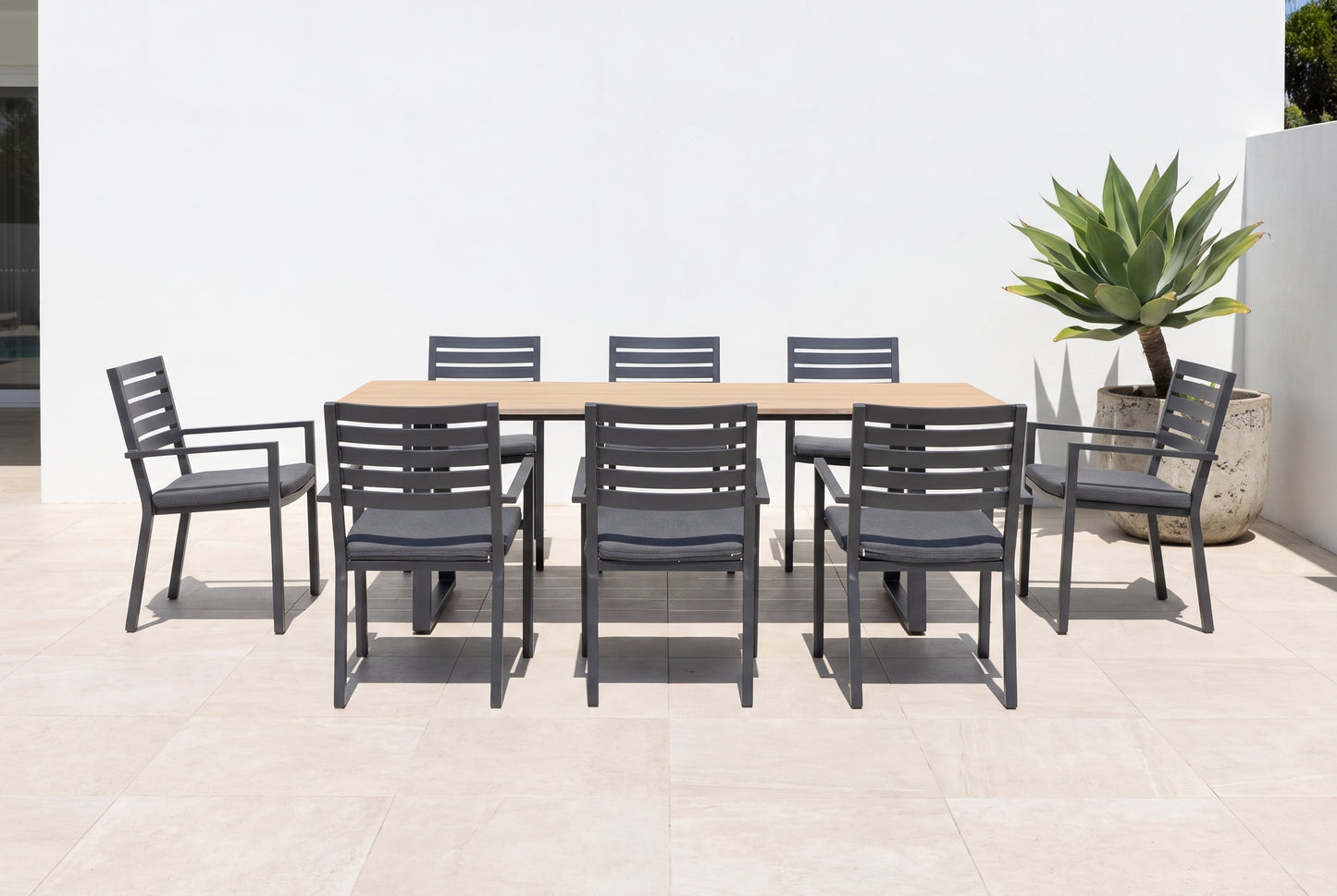 TIARELLA IX 8-Seater Outdoor Dining Setting on a light porcelain paved terrace