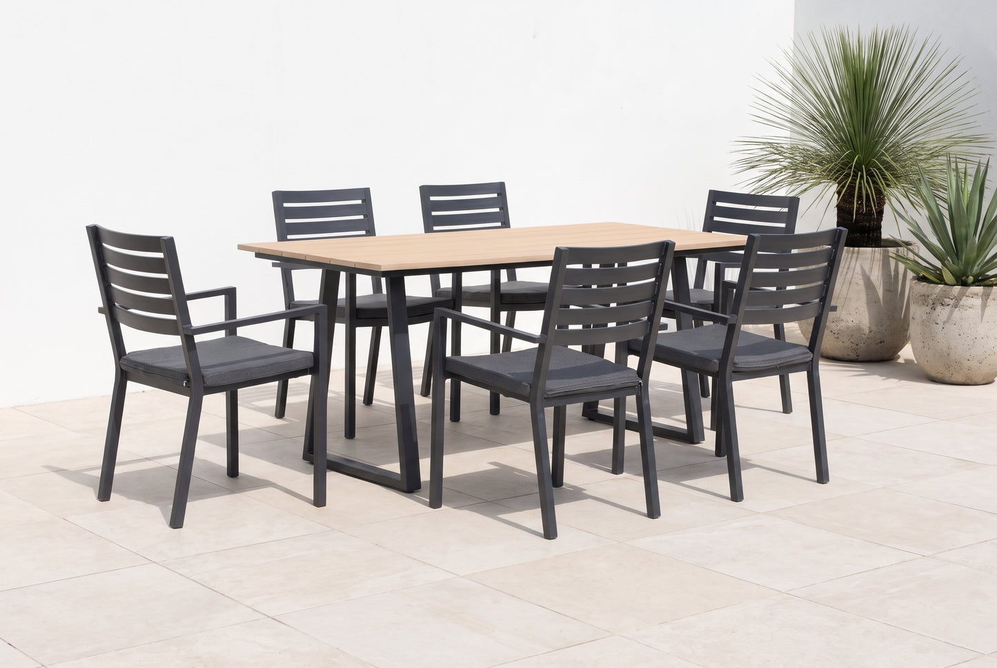 TIARELLA VII 6-Seater Outdoor Dining Setting on a light porcelain paved terrace