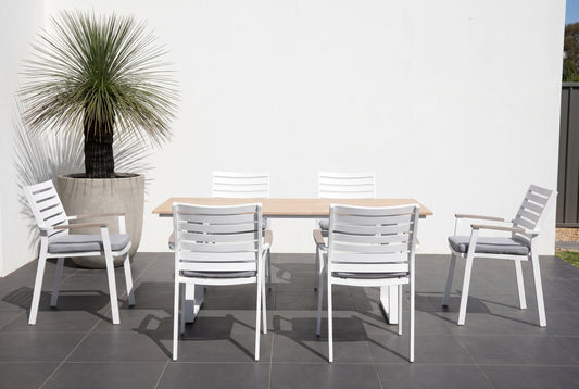 TIARELLO VII 6-Seater Outdoor Dining Setting on a dark charcoal porcelain paved terrace